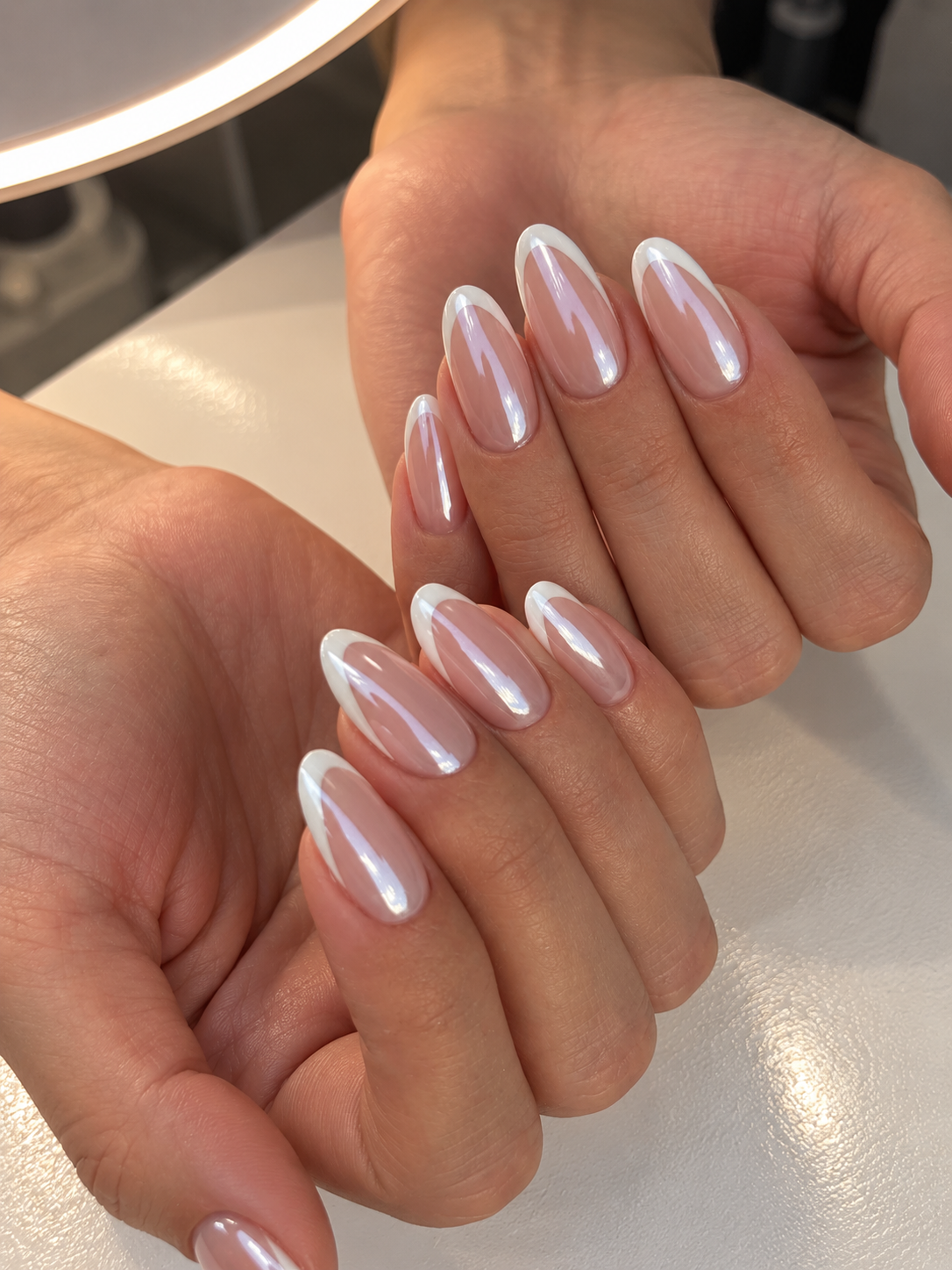 Milky chrome French almond nails with crisp white tips